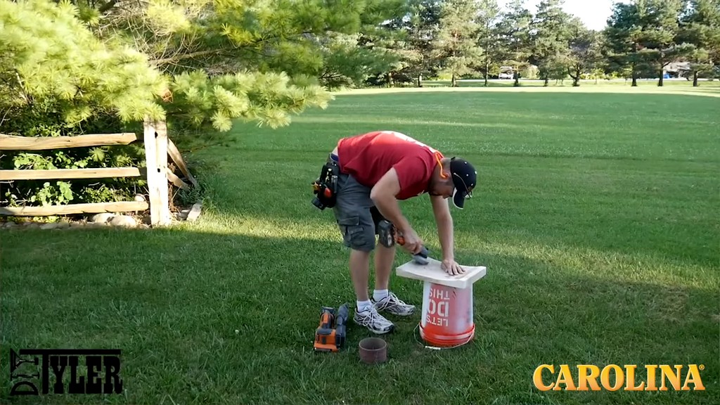 man sanding item outdoors