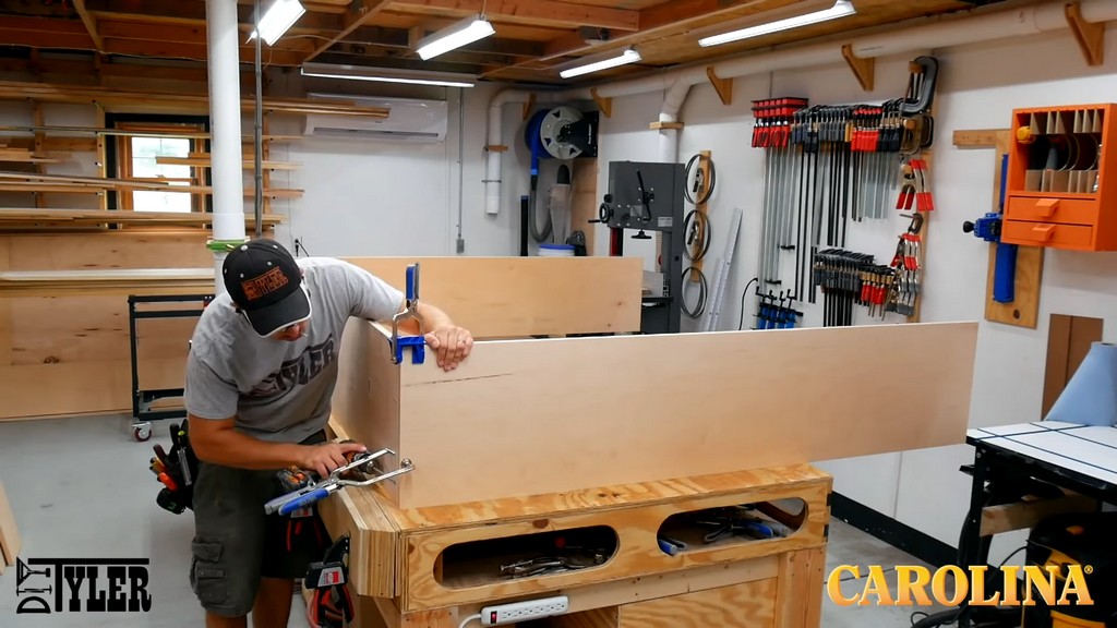 man clamping edges of new set of lockers